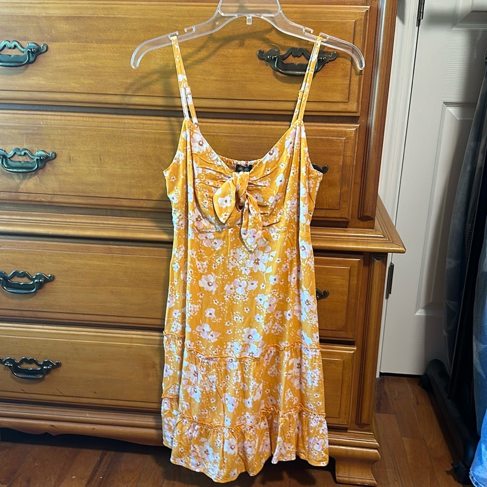 Lily Rose Kohl’s, yellow dress, pink flowers. Spaghetti strap, bow front, a line